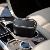VoltDesk car trash can placed in a car cup holder