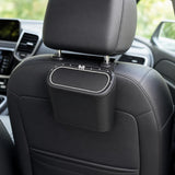 VoltDesk car trash can mounted on the back of a car headrest